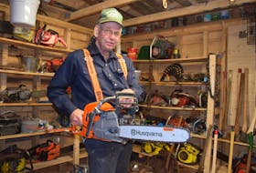 Keith Smith loves old chainsaws but he also likes many of the conveniences of today's models, such as automatic oilers, heated handlebars and, anti-vibration technology.