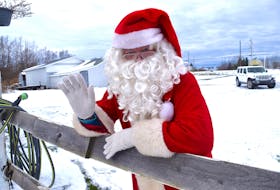 Santa Claus relaxes at the property of the Lynk family in Reserve Mines, where he was visiting a seven-year-old standardbred Lincoln Seelster. This will be the 40th and last year for Eddie Brookman to take on the role of jolly St. Nick to spread community cheer. Sharon Montgomery-Dupe/Cape Breton Post