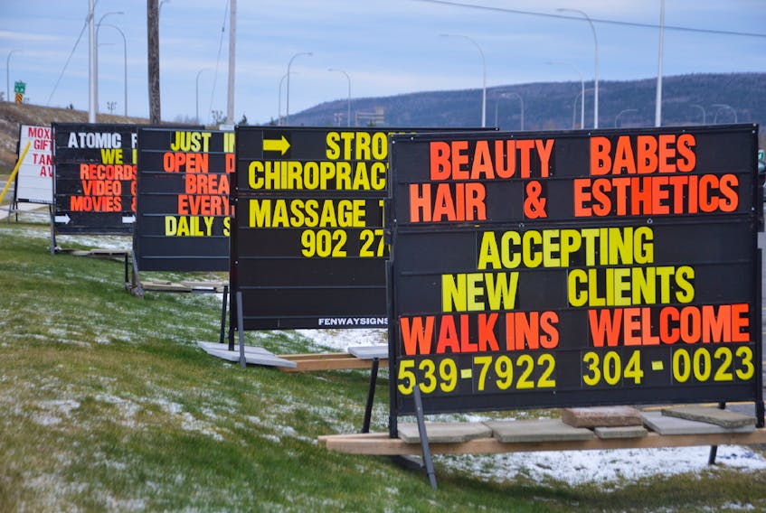Temporary signs used to advertise businesses in Sydney River. The Cape Breton Regional Municipality wants to regulate the number of these signs and is planning on reaching out to the public for input via a new online survey. IAN NATHANSON • CAPE BRETON POST