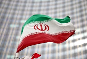 The Iranian flag flies in front of the UN office building, housing the International Atomic Energy Agency headquarters in Vienna, Austria. 