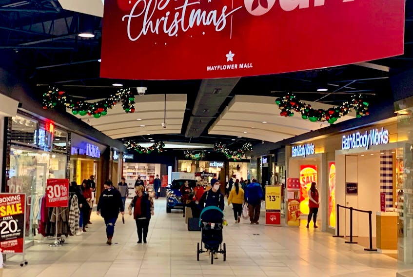 Meeting Christmas expectations can lead to stress, anxiety and depression. Experts say consumers should have both a plan and a budget when preparing for the holiday season. Above, shoppers wander the Mayflower Mall in Sydney. DAVID JALA/CAPE BRETON POST 