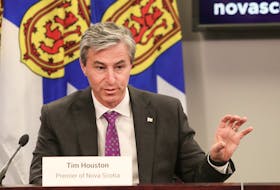 Premier Tim Houston answers a question from a reporter during a Nova Scotia COVID-19 news briefing at One Government Place in Halifax on Tuesday, Dec. 7, 2021.