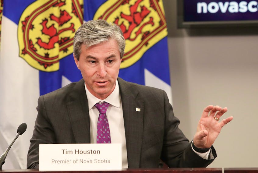 Premier Tim Houston answers a question from a reporter during a Nova Scotia COVID-19 news briefing at One Government Place in Halifax on Tuesday, Dec. 7, 2021.