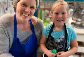 Dianne Fullerton and her six-year-old granddaughter Kyaira are all smiles. The P.E.I. baker has passed her passion along to her granddaughter, who now helps out in the kitchen as they prepare for Christmas.  - Contributed