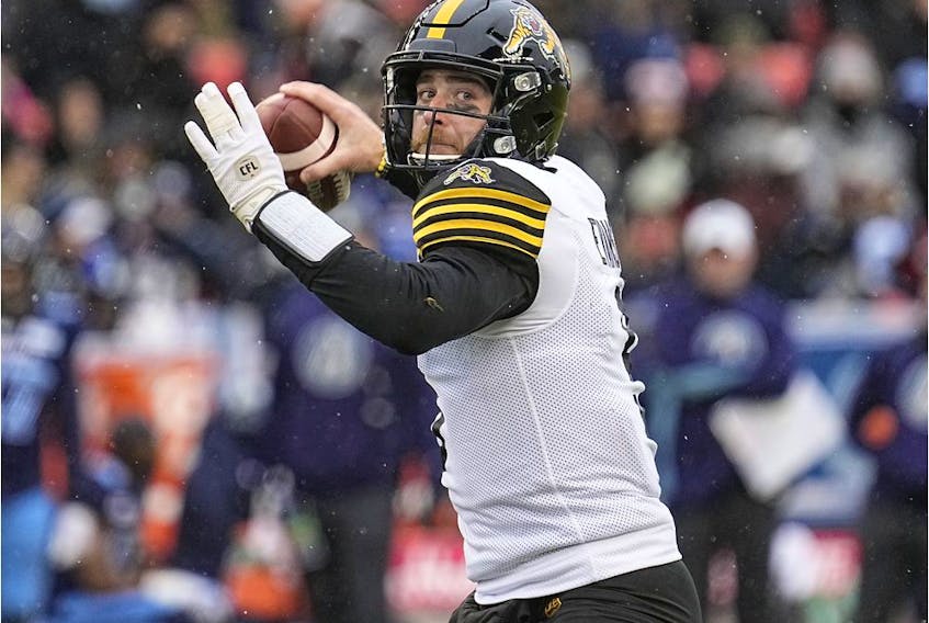 Hamilton Tiger-Cats quarterback Dane Evans (9) goes to throw a pass against the Toronto Argonauts during the first half of the Canadian Football League Eastern Conference Final game at BMO Field. 