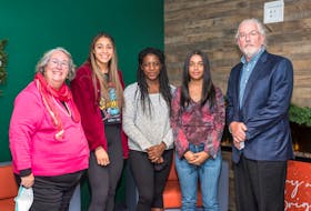 Jennie Gunn, left, stands with three CBU students and recipients of the Wanda Robson Scholarships Hailey MacLeod, Betty Amoah Gyekyewaa, Olivia Karigey and Jeannine Deveau Achievement Fund representative Bill Gunn as part of the $500,000 donation announcment to help establish the Wanda Robson Scholarships on Dec. 7.