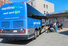 Passengers prepare to board a Maritime Bus at the terminal in Halifax.
