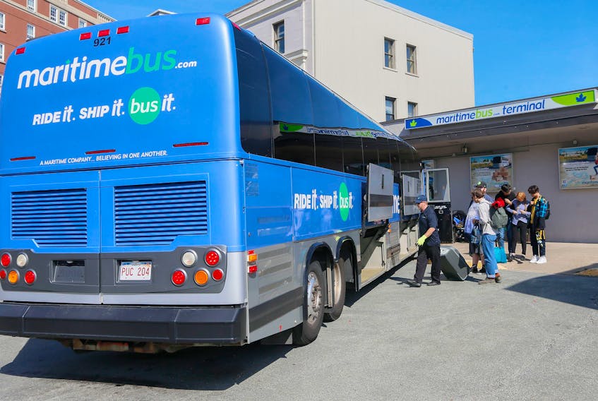 Passengers prepare to board a Maritime Bus at the terminal in Halifax.