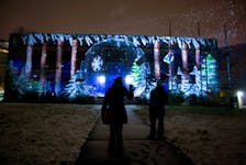 FOR WEATHER STORY:
A snow globe is projected onto the former Halifax Memorial Library building, during the onset of a winter storm in Halifax Thursday December 8, 2021. The Christmas display is part of the DELIGHTFUL DOWNTOWN, light projection series.

TIM KROCHAK PHOTO