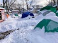 Most of the tents at Meagher Park in Halifax were partially snow-covered Thursday morning after the blizzard.