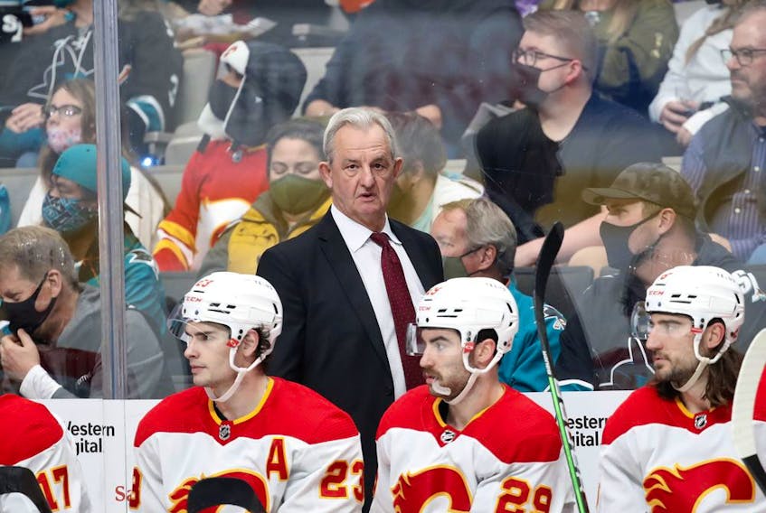 Calgary Flames head coach Darryl Sutter watches his team play the San Jose Sharks during NHL action at SAP Arena in San Jose on Tuesday night.