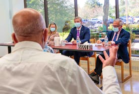 Dr. Kevin Orrell, right, CEO of the Office of Healthcare Professionals Recruitment, sits beside Nova Scotia Premier Tim Houston while in Windsor, N.S., during the recently held Speak Up for Health Care tours province wide in September. NOVA SCOTIA HEALTH AND WELLNESS