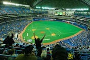 Fans cheer the Blue Jays on opening day 2004 at what was then called the SkyDome. GLENN LOWSON/POSTMEDIA FILES