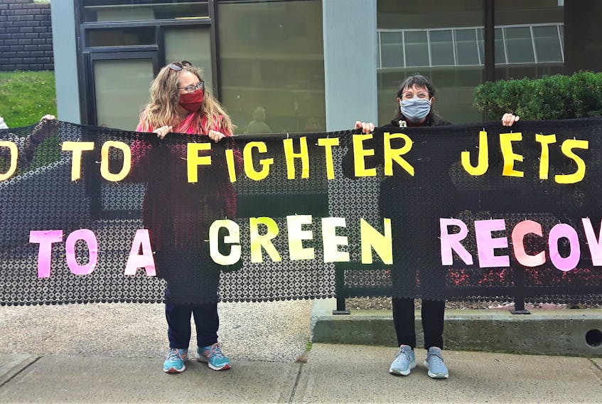 Members of Nova Scotia Women for Peace protest on Oct. 2, 2020, in front of Halifax MP Andy Fillmore's office, drawing attention to Canada's plans to acquire next-generation fighter jets, and suggesting the possible alternative use of those funds.