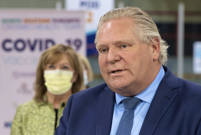 Ontario Premier Doug Ford speaks during the daily briefing at a mass vaccination centre in Toronto on Tuesday, March 30, 2021.  