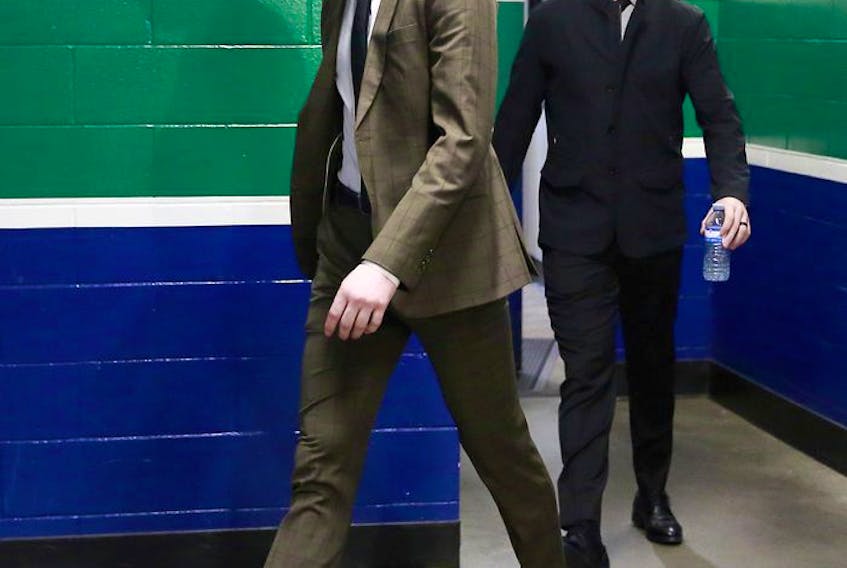  Thatcher Demko (left) and Tanner Pearson of the Vancouver Canucks walk to the Canucks dressing room before their NHL game against the Montreal Canadiens at Rogers Arena on March 10, 2021.