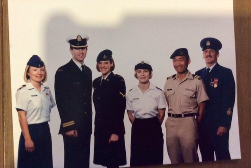  Maj. Ted Itani, second from right, appears in an advertisement the Canadian Forces published to promote diversity.