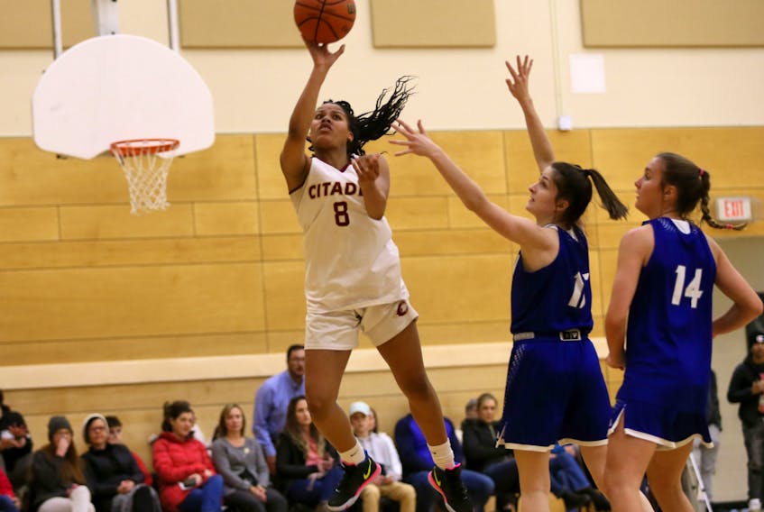 Citadel's Kyasiah Derry drives to the hoop past Lockview defenders Emma Foye and Ellie Lancaster during a metro high school basketball league game. The Phoenix will face the Dartmouth Spartans in the Capital Region championship on Tuesday. - Tim Krochak / The Chronicle Herald