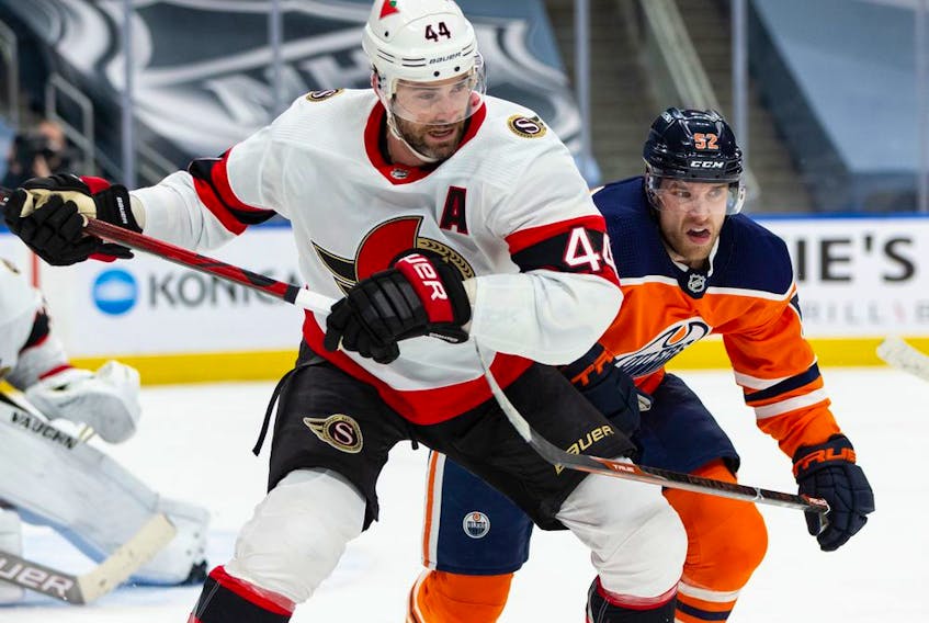 Ottawa Senators' Erik Gudbranson battles with Edmonton Oilers' Patrick Russell during first period NHL action at Rogers Place in Edmonton, on Wednesday, March 10, 2021.