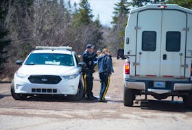 Police vehicles pass through an RCMP checkpoint on Portapique Beach Road on Wednesday, April 22, 2020.
Ryan Taplin - The Chronicle Herald