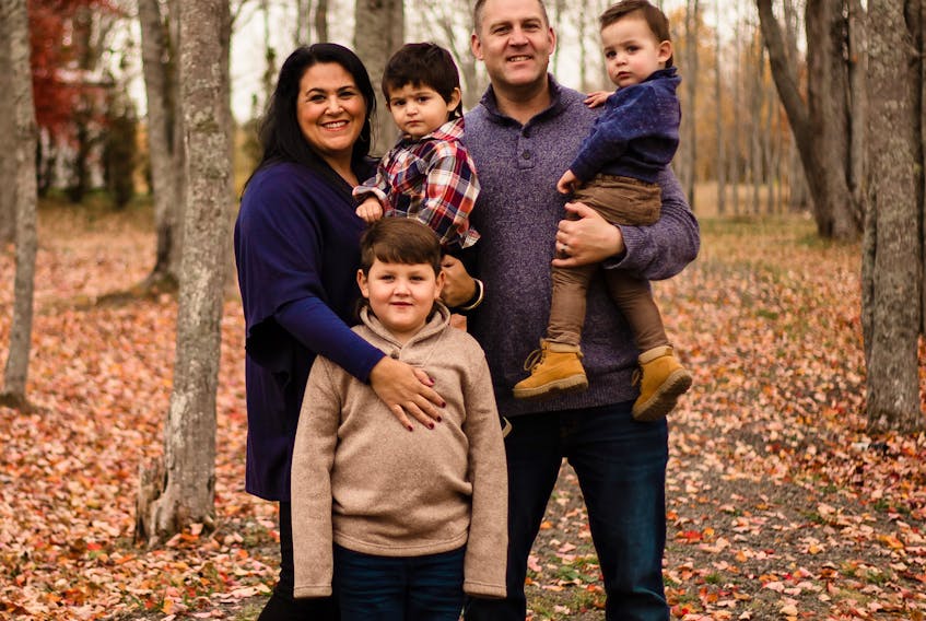 Carolynn Dubé, executive director of Fertility Matters Canada, with her three sons and husband Bryan. Originally a Coté from North Sydney, Dubé became involved in fertility advocacy, education and awareness after becoming a mom to three boys through in vitro fertilization treatment. The couple's sons, pictured here, are seven-year-old Bren and two-year-old twins Shae, in his mother's arms, and Theo, in his dad's. CONTRIBUTED 