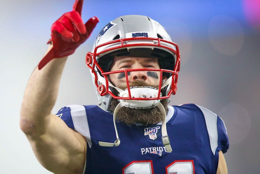 New England Patriots wide receiver Julian Edelman points to the crowd before a game against the Tennessee Titans.