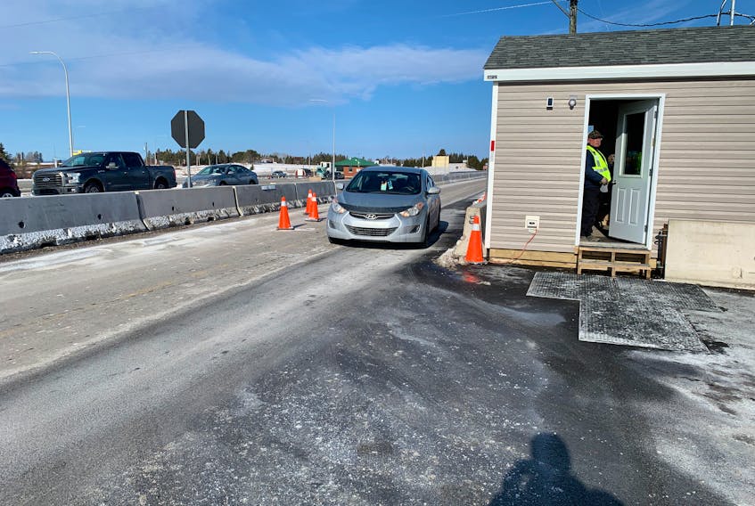 A motorist pulls up to the Nova Scotia entry control point at Fort Lawrence in this photo from March. Hopes of a reconnection to the Atlantic bubble on April 19 appear to be dashed as Nova Scotia Premier Iain Rankin announced Tuesday that New Brunswickers will have to self-isolate for 14 days upon entering the province due to a spike in COVID-19 cases in that province.