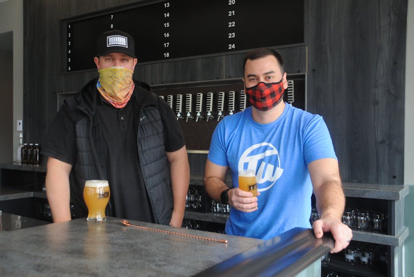 Friends Steve Martin, left, and Craig Farwell were co-organizers of the Newfoundland Craft Beer Festival before they decided to open a new bar and eatery highlighting the province's many breweries. — Andrew Robinson/The Telegram