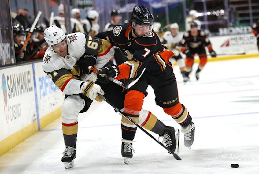 Anaheim Ducks defenceman Ben Hutton (right) battles Max Pacioretty of the Vegas Golden Knights during a game in Februar. The Maple Leafs acquired Hutton on Monday for a fifth-round pick in 2022.