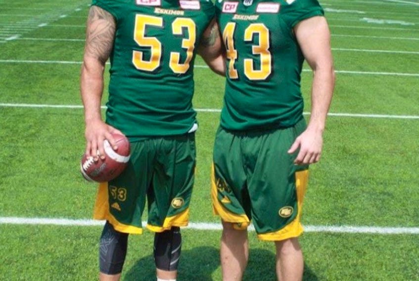  Ryan, left, and Neil King pose for a photo at Commonwealth Stadium after the Edmonton Football Team reunited the pair during free agency in 2016. Supplied photo