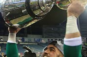  Edmonton long-snapper Ryan King hoists the Grey Cup after defeating the Ottawa Redblacks 26-20 in the Grey Cup final in Winnipeg on Nov. 29, 2015. Brian Donogh / Postmedia, file