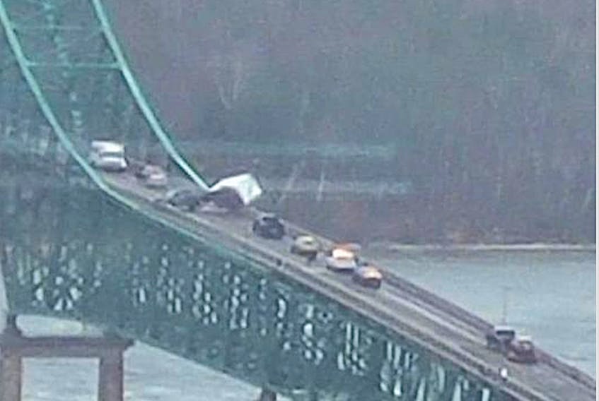 A truck and trailer flipped on the Seal Island bridge on Highway 105 in Boularderie        East, at about 9:36 a.m. Tuesday morning. The bridge is currently closed and efforts are underway to remove the vehicles. Facebook photo
