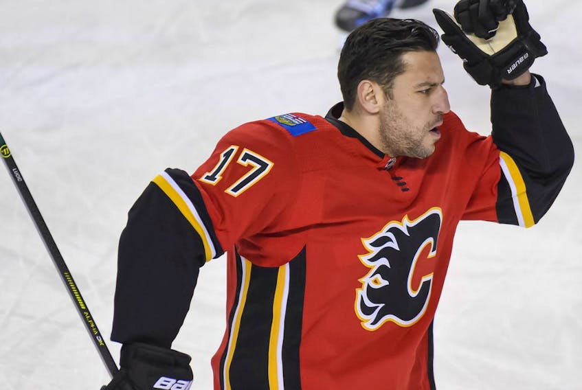  Milan Lucic vibes to the music during the warm-up before a game against the Edmonton Oilers at the Scotiabank Saddledome on Wednesday, March 17, 2021.