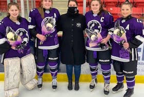 Four members of the Cape Breton Lynx of the Maritime Female Under-18 Major Hockey League recently finished their final season with the Membertou-based team. From left, Emma Swansburg (Shelburne), Jessica MacLean (Iona), Sonya Lynk (head coach and owner), Madison Corbett (Whitney Pier) and Morgan Bates (New Waterford). CONTRIBUTED • PAUL CARROLL