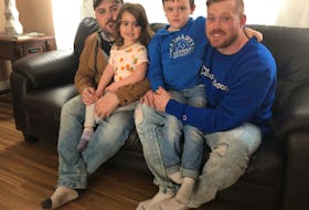 From left, sitting, are Jeremy Tanner and Troy Currie, who are splitting the $15,000 cost for a Cape Breton man to attend the two-month treatment program at Together We Can, a substance use disorder treatment facility in Vancouver. With them are their children, from left, Ava and Jaxson, who are both four and are big inspirations in the two men's recovery from addiction. NICOLE SULLIVAN/CAPE BRETON POST 