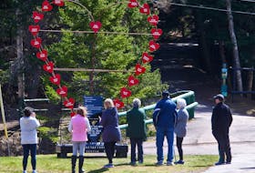 FOR MASS SHOOTING ANNIVERSARY COVERAGE:
People stop to look at the large heart memorial, made with names of those killed in the Nova Scotia mass shooting and placed at the trail head in Victoria Park in Truro, NS Wednesday April 14, 2021.

TIM KROCHAK PHOTO
