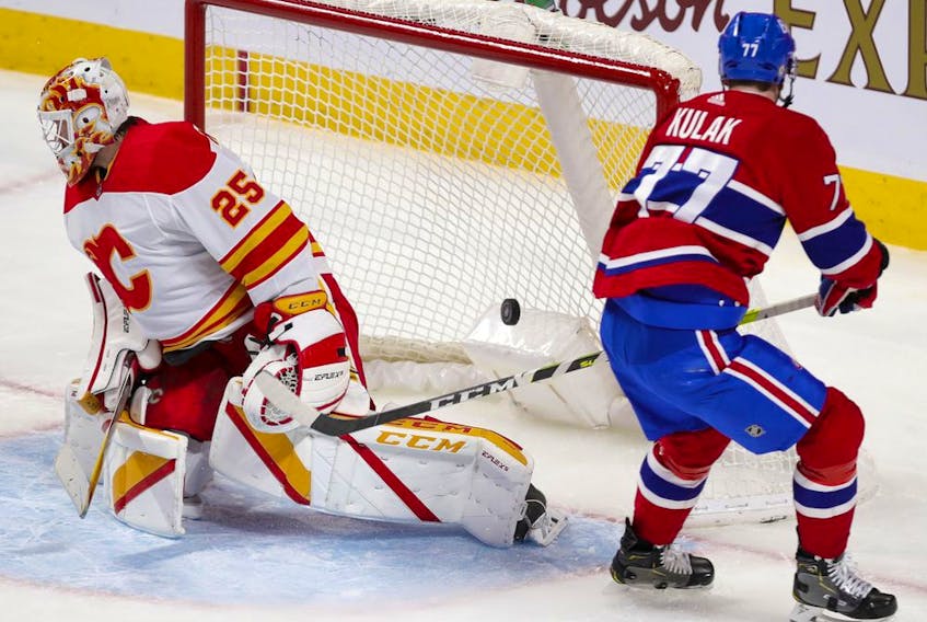 Montreal Canadiens defenceman Brett Kulak scores a goal against Calgary Flames' Jocob Markstrom during second period in Montreal on April 14, 2021. 