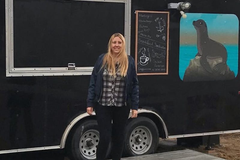 Amber Holt of Pleasant Bay stands in front of her new food truck The Nosy Seal Café that she will open with her partner on their property on May 1. Holt, who had been working in Alberta, said they moved home to open the food truck business. SUBMITTED - Sharon Montgomery