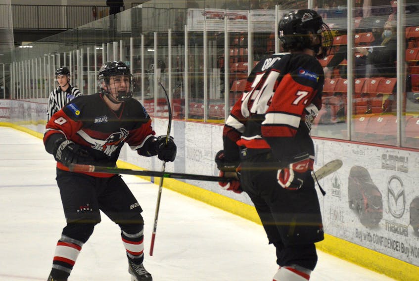 Brandon Grant of the Kameron Jr. Miners, right, celebrates with teammate Alex MacKinnon after scoring a goal during the Nova Scotia Junior Hockey League Sid Rowe Division championship series against the Antigonish AA Munro Bulldogs. The Jr. Miners will play the East Hants Penguins in the league championship, beginning this weekend. JEREMY FRASER • CAPE BRETON POST