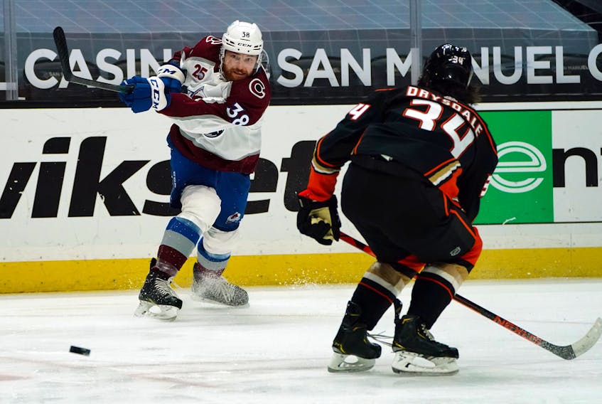 Colorado Avalanche winger Liam O'Brien shoots past Anaheim Ducks defenceman Jamie Drysdale during an April 4 NHL game in Anaheim.