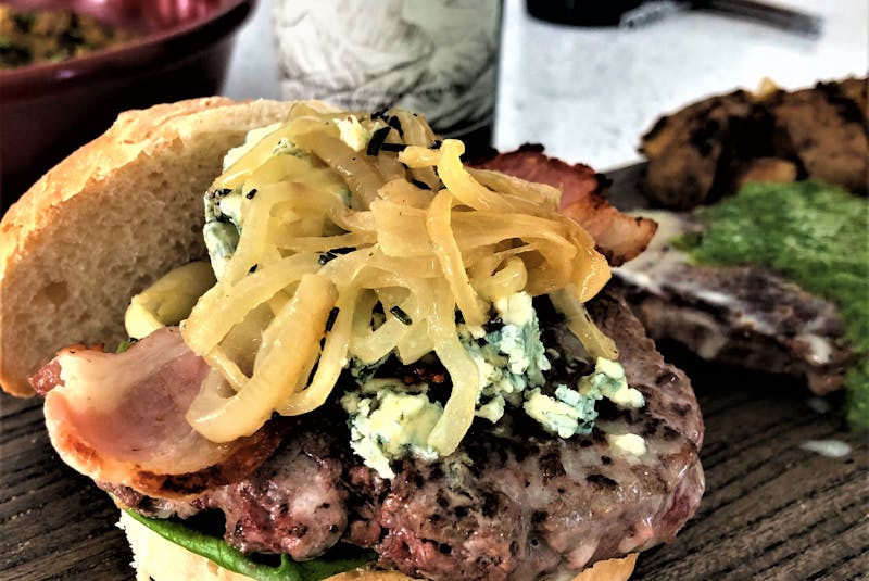 Mark DeWolf recommends easy-drinking Malbec such as Alamos from Catena as a pairing to hamburgers such as his version topped with blue cheese and caramelized onions. Photo: Julia Webb