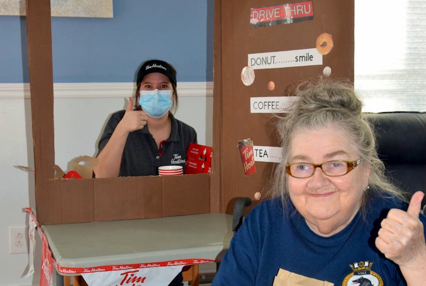 Linda Mayo, President of the Glen Haven Manor Resident Council, was one of the many residents to enjoy the Tim Hortons Drive Thru that was created by Glen Haven in partnership with Pictou County’s Tim Hortons. Mayo was served by Recreation Programmer Nicole Blackwood who came up with the idea for this fun event and also coordinated its implementation. KIM DICKSON PHOTO