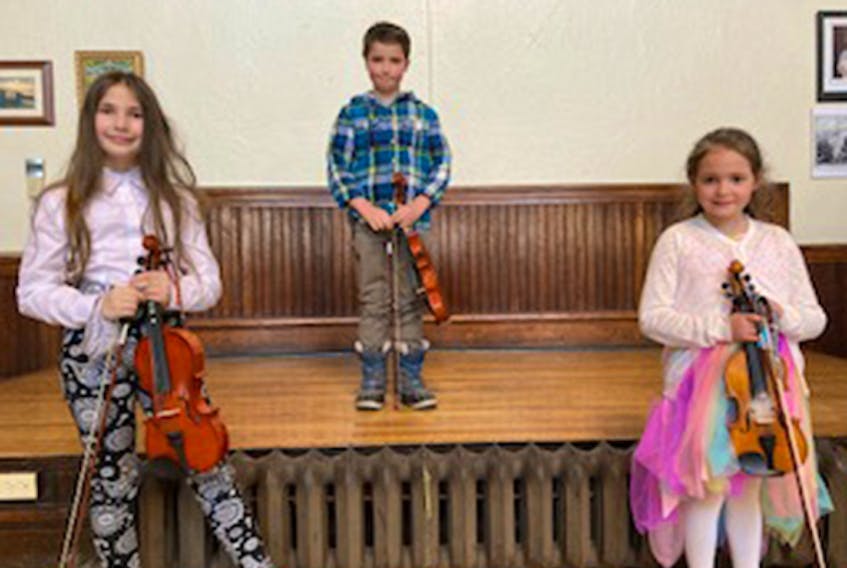 Madeleine Hendsbee, James Gamble and Maelle Melong were participants in fiddle classes at First Presbyterian Church in the New Glasgow Music Festival.