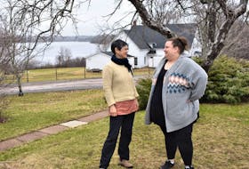 With the scenic views as a backdrop, executive director Nanci Lee (left) and food services manager Megan Miller chat just outside their offices, at the Tatamagouche Centre.