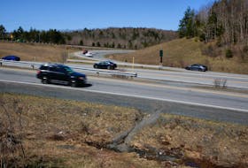 Traffic flows from Highway 101, to and from the Beaver Bank Connector at exit 2 in Lower Sackville Thursday, April 15, 2021. Local residents use a path, seen at lower right, to access the nearby transit terminal after walking through lanes of traffic. - Tim Krochak