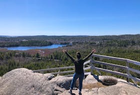 Heather Fegan stands atop the lookoff at Skull Rock, off the Musquodoboit Trailway.