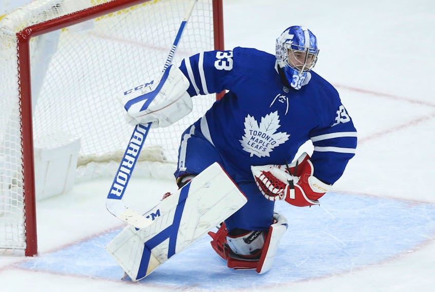 Toronto Maple Leafs goalie David Rittich makes a glove save during the second period against his former team the Calgary Flames in Toronto on Tuesday, April 13, 2021.  