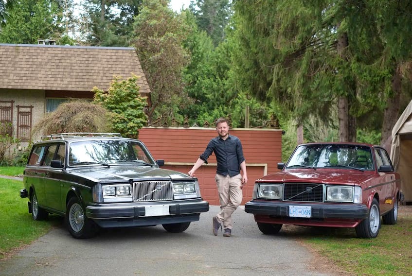  Douglas Peterson-Hui with his cars — Kevin, the 1982 Volvo 245 GL wagon on the left, and Freja, a 1981 Volvo 242 GLT Coupe. Contributed/Douglas Peterson-Hui