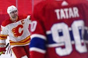  Calgary Flames defenceman Mark Giordano reacts with teammates after scoring a goal against the Montreal Canadiens during the second period at the Bell Centre.