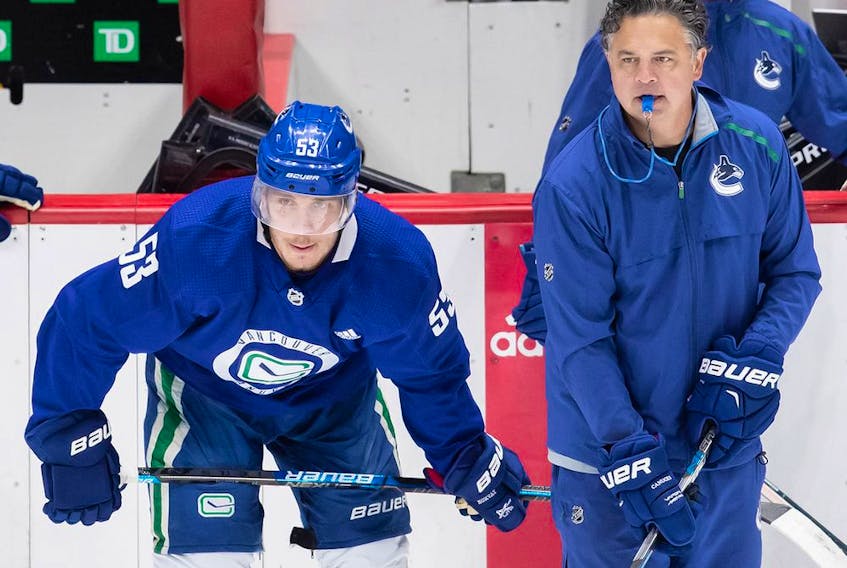  Vancouver Canucks captain Bo Horvat (left) and head coach Travis Green.